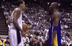 Kobe Bryant and Chris Webber arguing on court