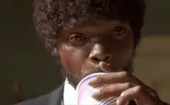 Jules Winnfield drinks and smiles