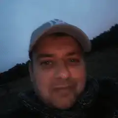 Man shooting blue laser beams from eyes