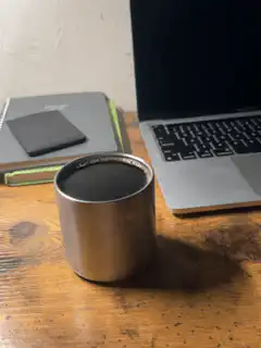Steam rising from a metal cup