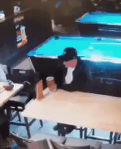 Man spills beer on himself at pool table