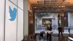 Man carrying Twitter logo