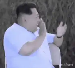 Kim Jong Un laughing and clapping
