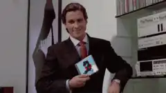 Gordon Gekko holding a CD