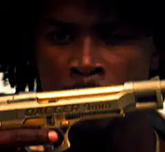 Man holding golden dagger gun