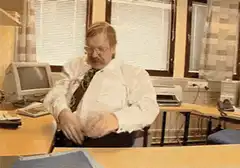 Man throws everything off his desk