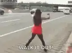 Woman dancing on highway shoulder