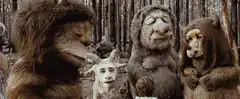 Three furry monsters singing in the woods