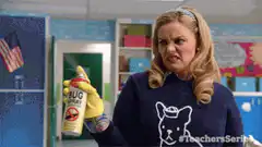 Woman sprays bug spray in classroom