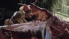 Gremlins shoot each other with laser guns