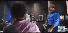 Dwayne Johnson dancing in an office