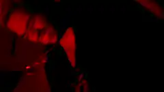 man in red light holding gun
