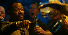Will Smith toasting with a drink