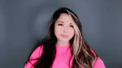 Woman in pink shirt giggling