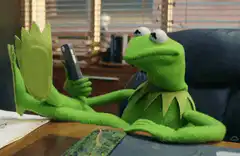 Kermit the Frog relaxing with feet up