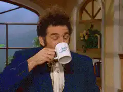 Michael Richards drinks coffee and spills it