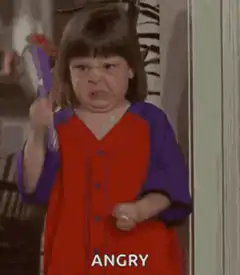 Angry little girl with purple hairbrush