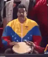Nicolás Maduro playing a drum