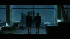 Silhouettes watching the city at night