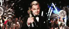 Leonardo DiCaprio holding Oscar