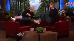 Ellen and guest on red couches