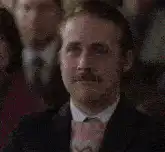 Ryan Gosling Smiling and Looking Down