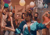 Woman in blue tracksuit dancing at party