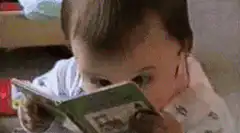 baby reading a book