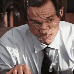 Man with tape on face waves