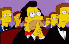 Simpsons man shushing in audience