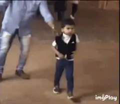 Toddler takes off vest and dances