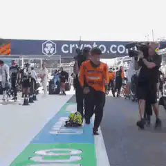 Lando Norris celebrates with McLaren team