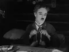 Charlie Chaplin eating spaghetti