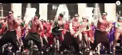Men in pink shirts dancing on stage