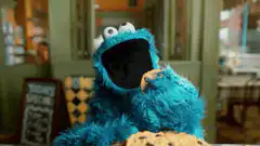 Cookie Monster eats a cookie