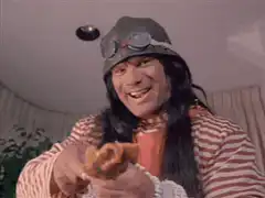 Eugene Levy's face is covered in peanut butter