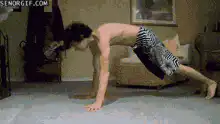 Man does superman pushups