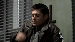 Dean Winchester adjusting his jacket
