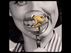 Woman looking at tiny man with magnifying glass