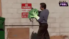 Ron Swanson throws broccoli in dumpster