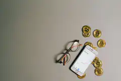 Bitcoin coins and smartphone with chart