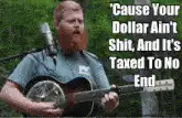 Man playing guitar with tax lyrics