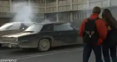 Couple watching smoking car