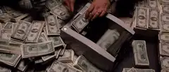 Tony Montana laughing on the phone with money