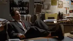 Fox Mulder relaxing on desk