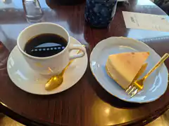 coffee and cheesecake on table