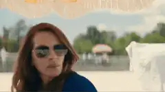 People running from a giant ship on the beach