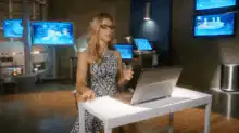 Woman in newsroom doing thumbs down