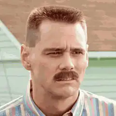 Jim Carrey squinting and smiling
