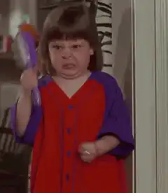 Angry girl with purple brush